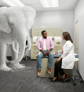 A doctor talking to his potential XYWAV patient.